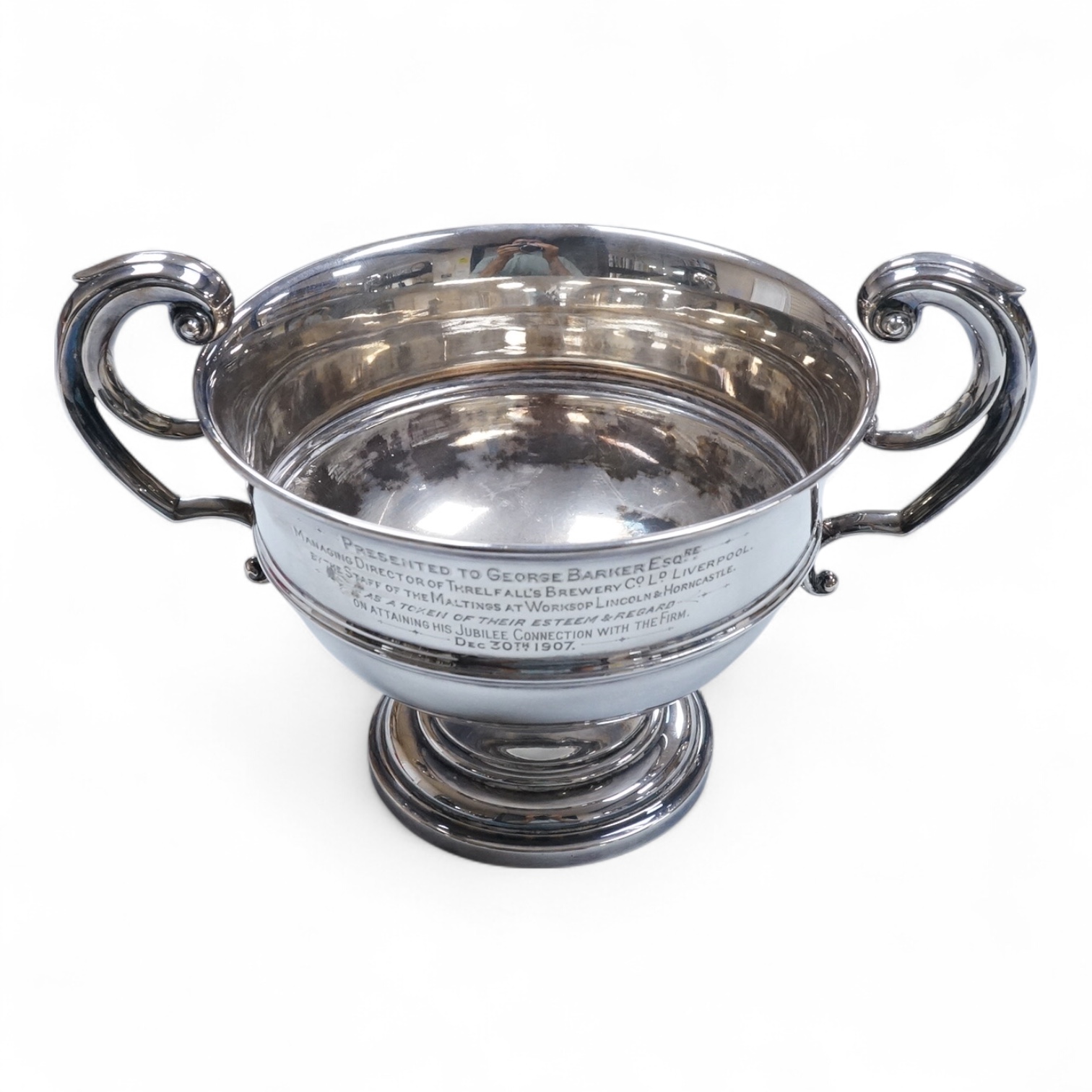 An Edwardian silver two handled presentation pedestal bowl by James Dixon & Sons, Sheffield, 1907, with engraved inscription, diameter 14.8cm excluding the handles, 14.3oz.